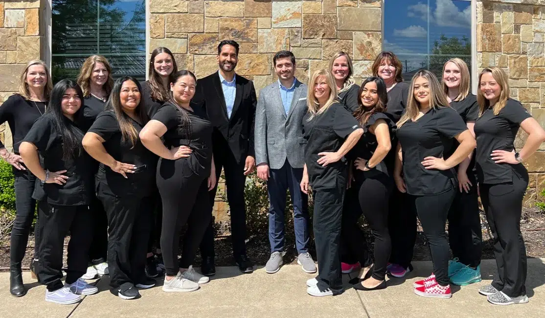 Anthony Patel Orthodontics team with doctors and clinicians in black scrubs