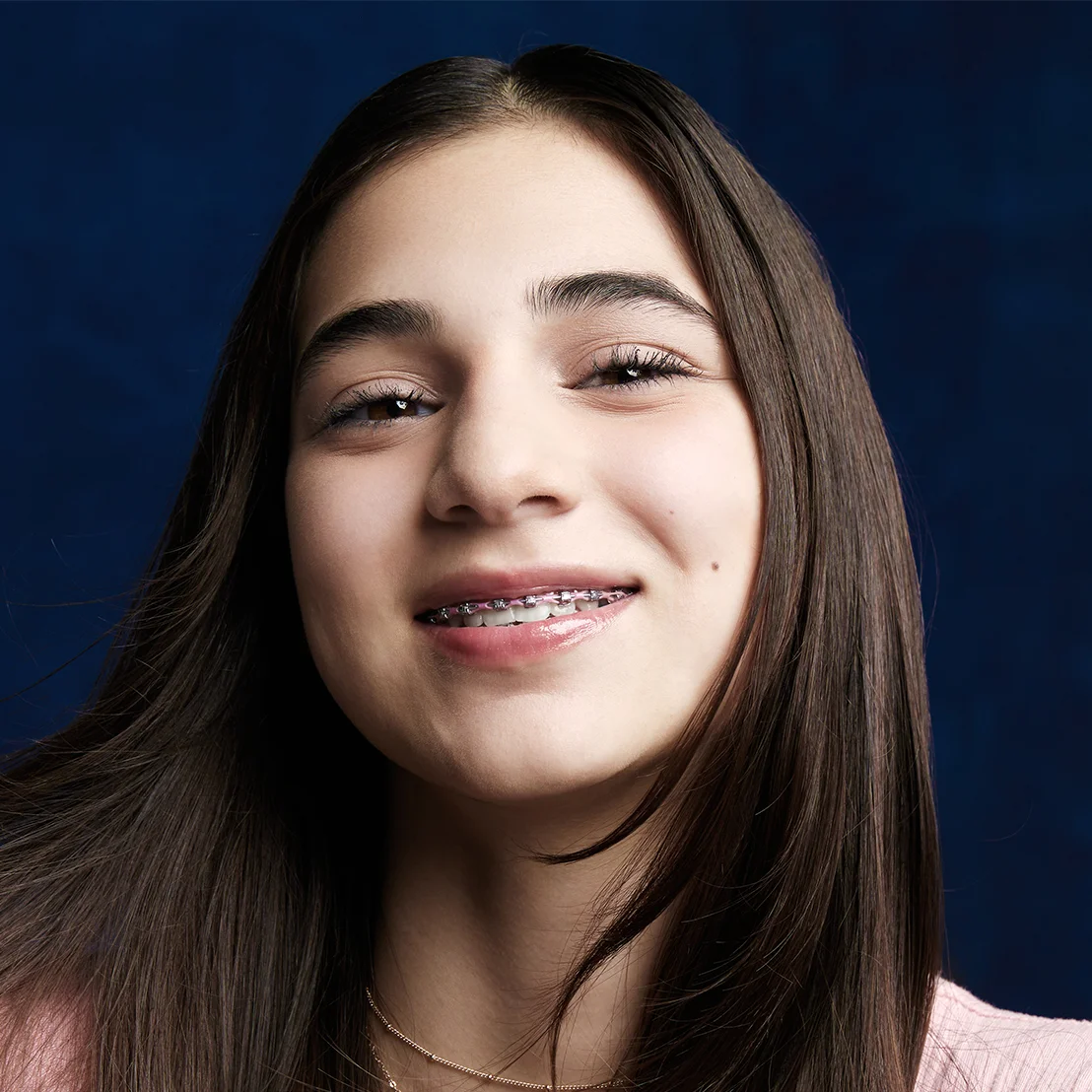 Girl smiling with braces in Fort Worth | Anthony Patel Orthodontics